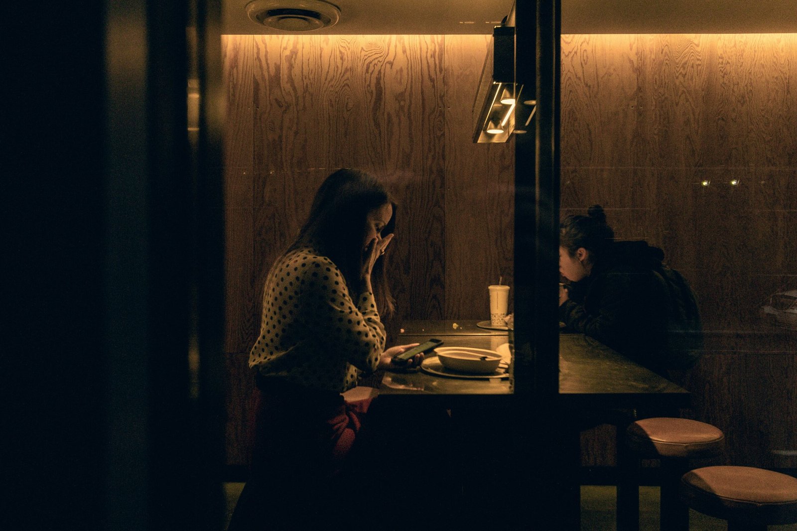 woman and man sitting on chair near table